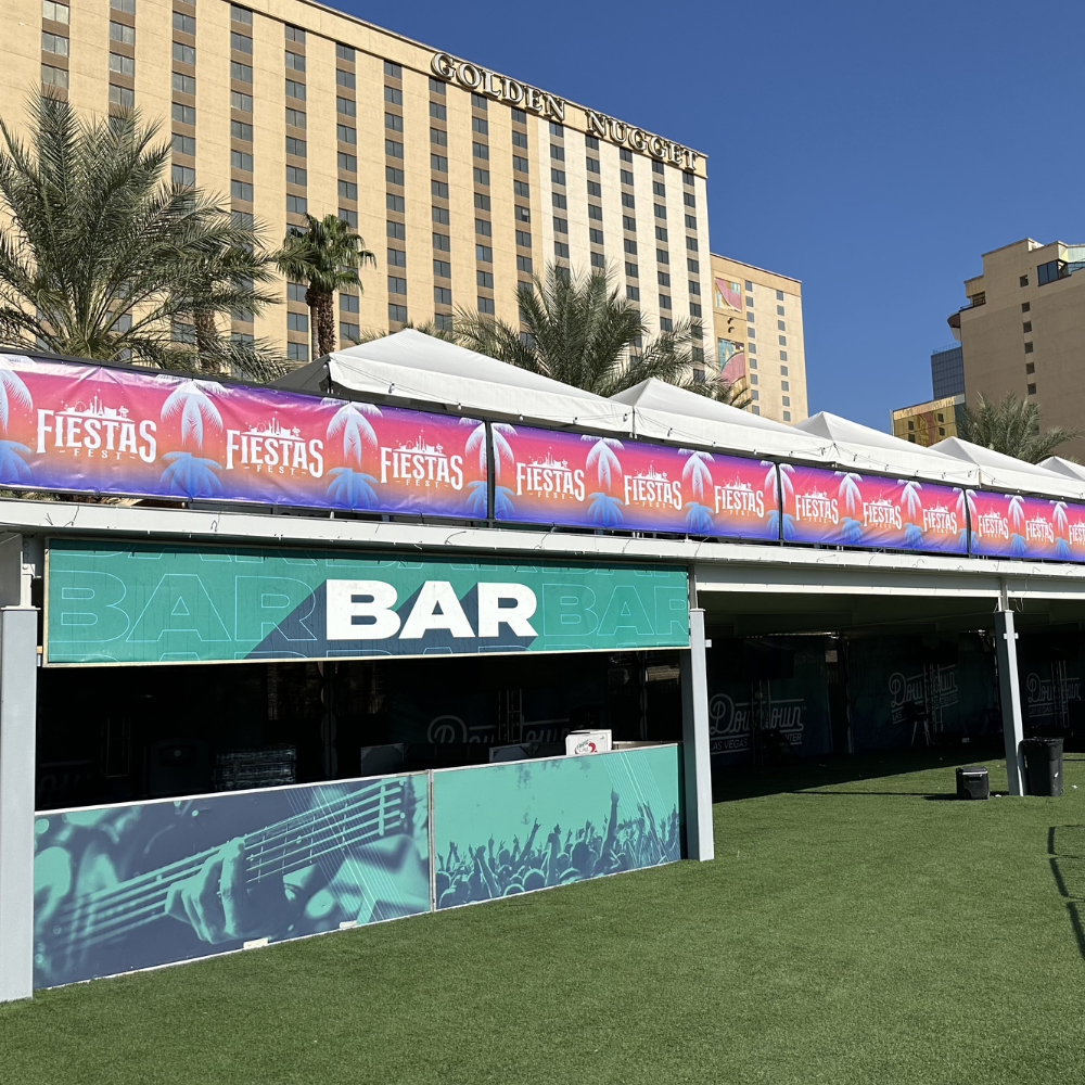 Custom t-shirt screen printing with red ink using professional squeegee technique in Las Vegas