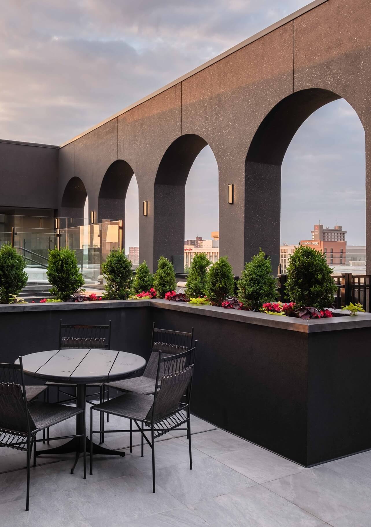 A patio with a table and chairs on it.