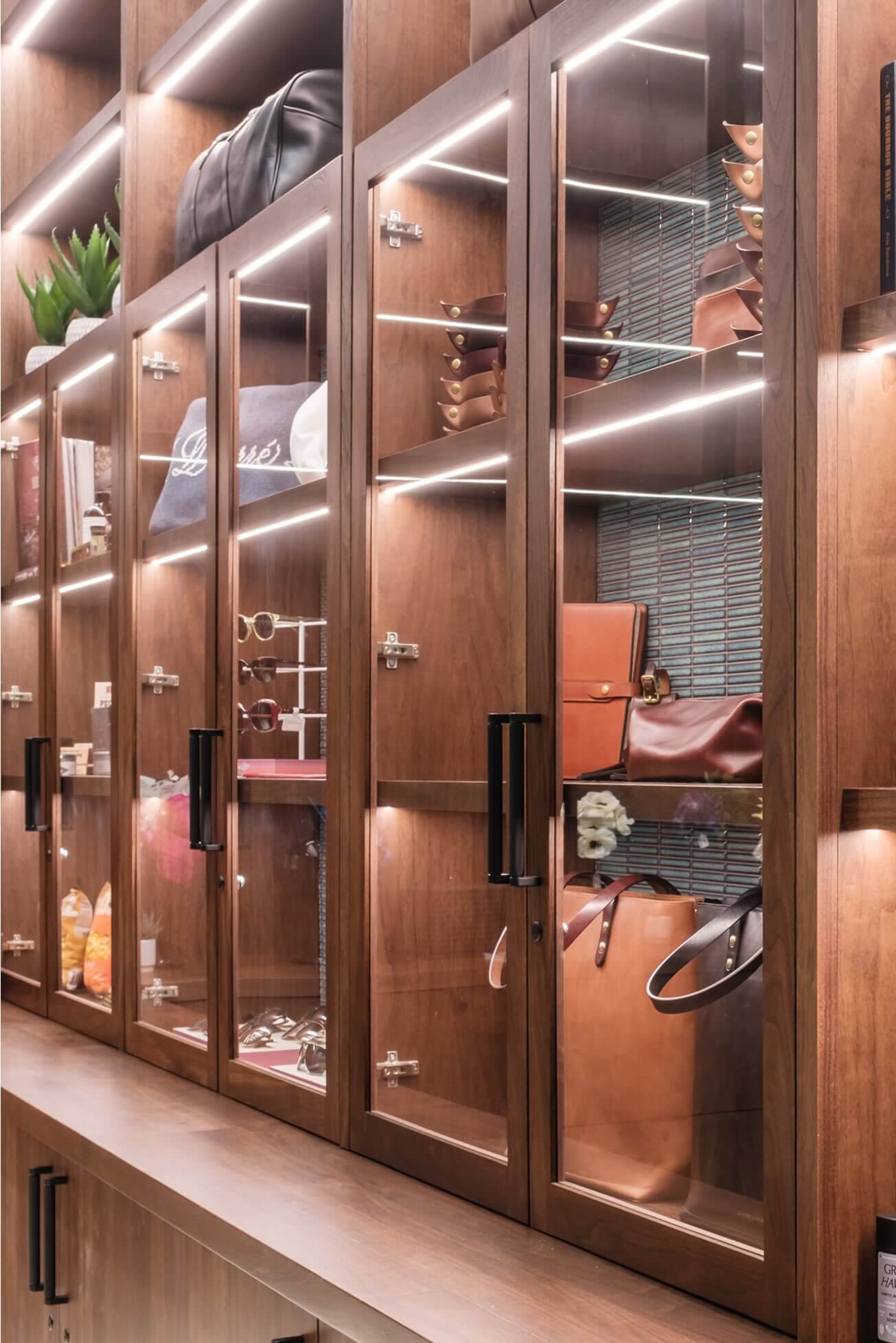A large wooden shelf filled with lots of purses.