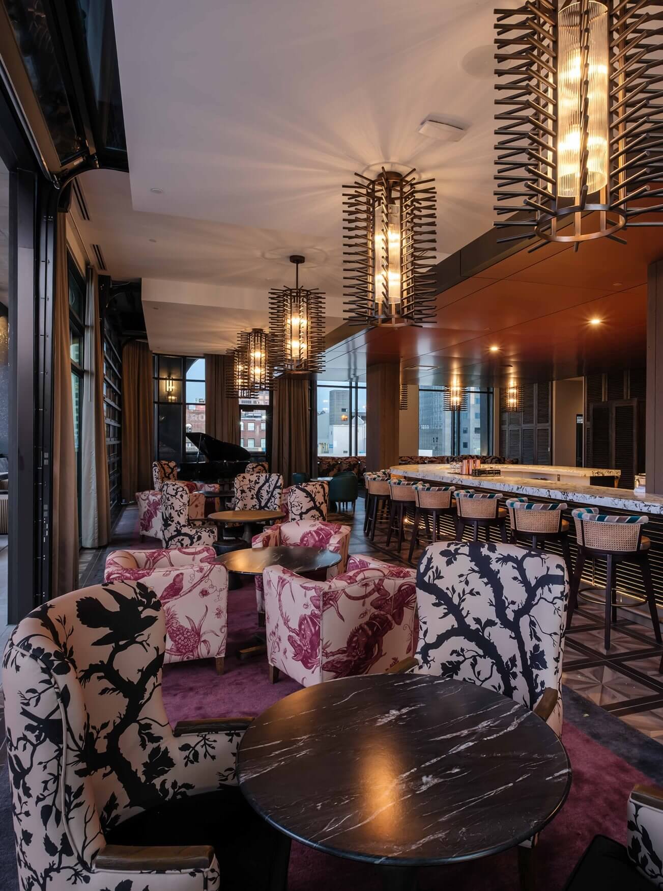 A room with a bunch of chairs and tables.