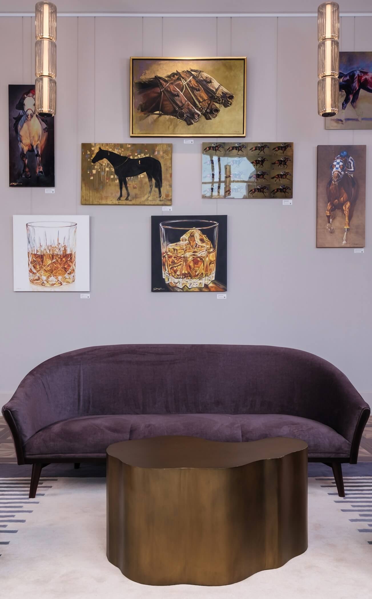 A living room filled with furniture and pictures on the wall.