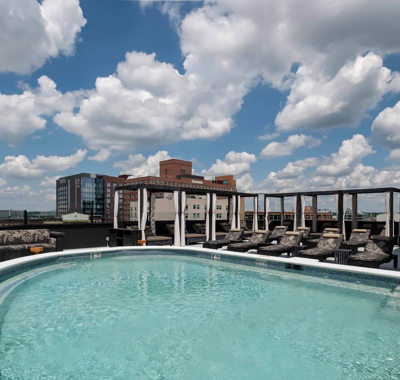 A large swimming pool on top of a building.