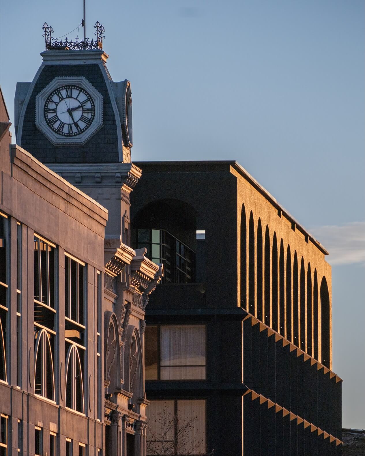 A building with a clock on the top of it.