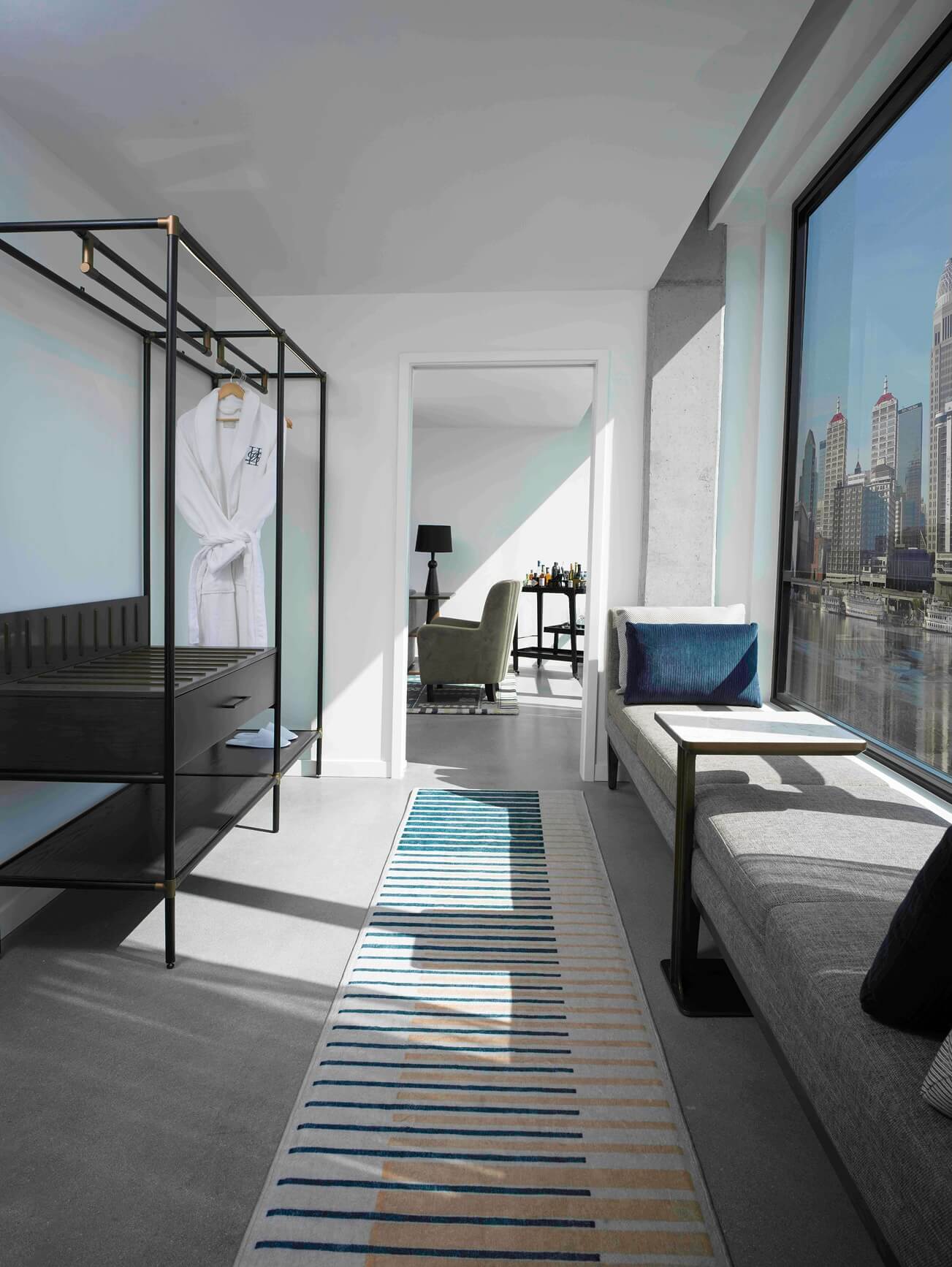 A room with a bed and a couch in it.