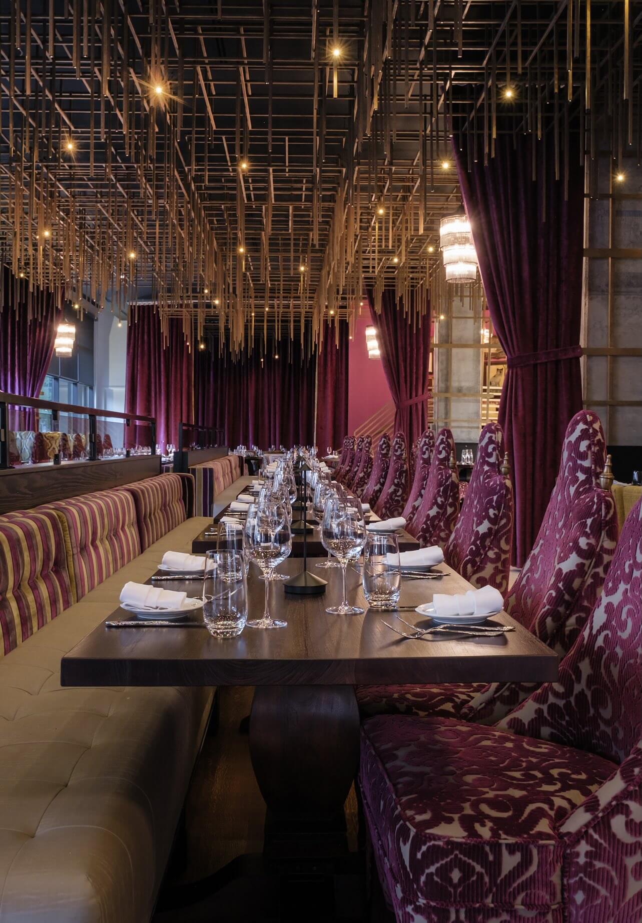 A long table is set with place settings and place settings.