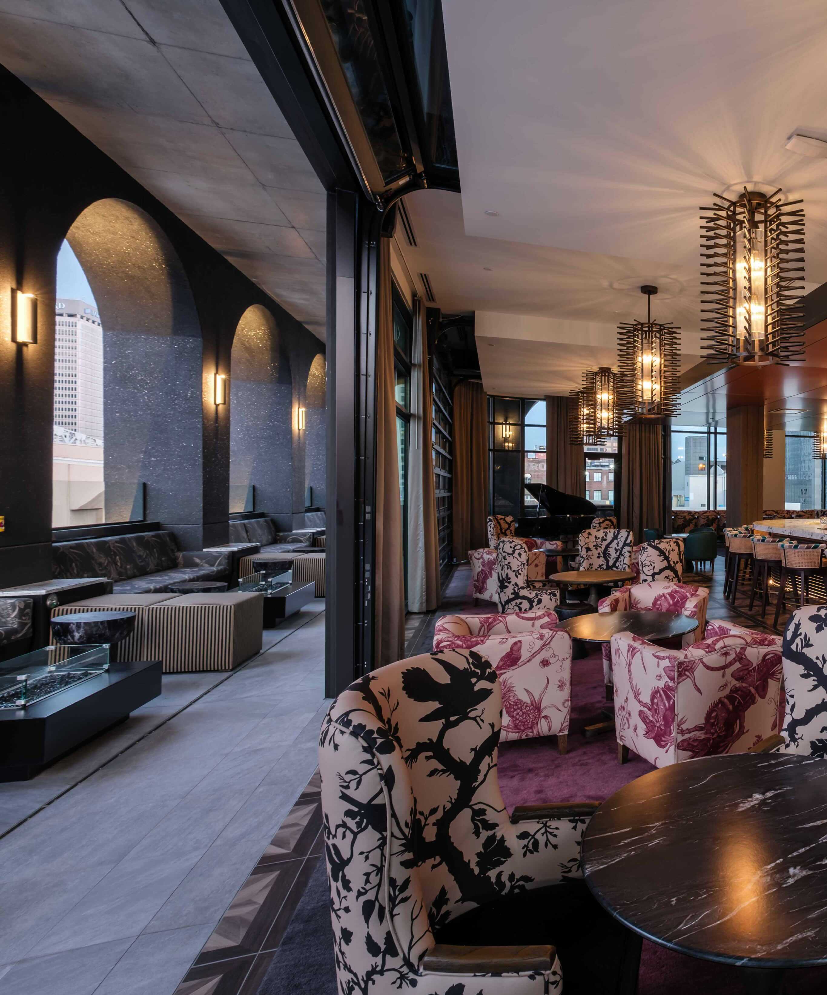 A room with a bunch of chairs and tables.