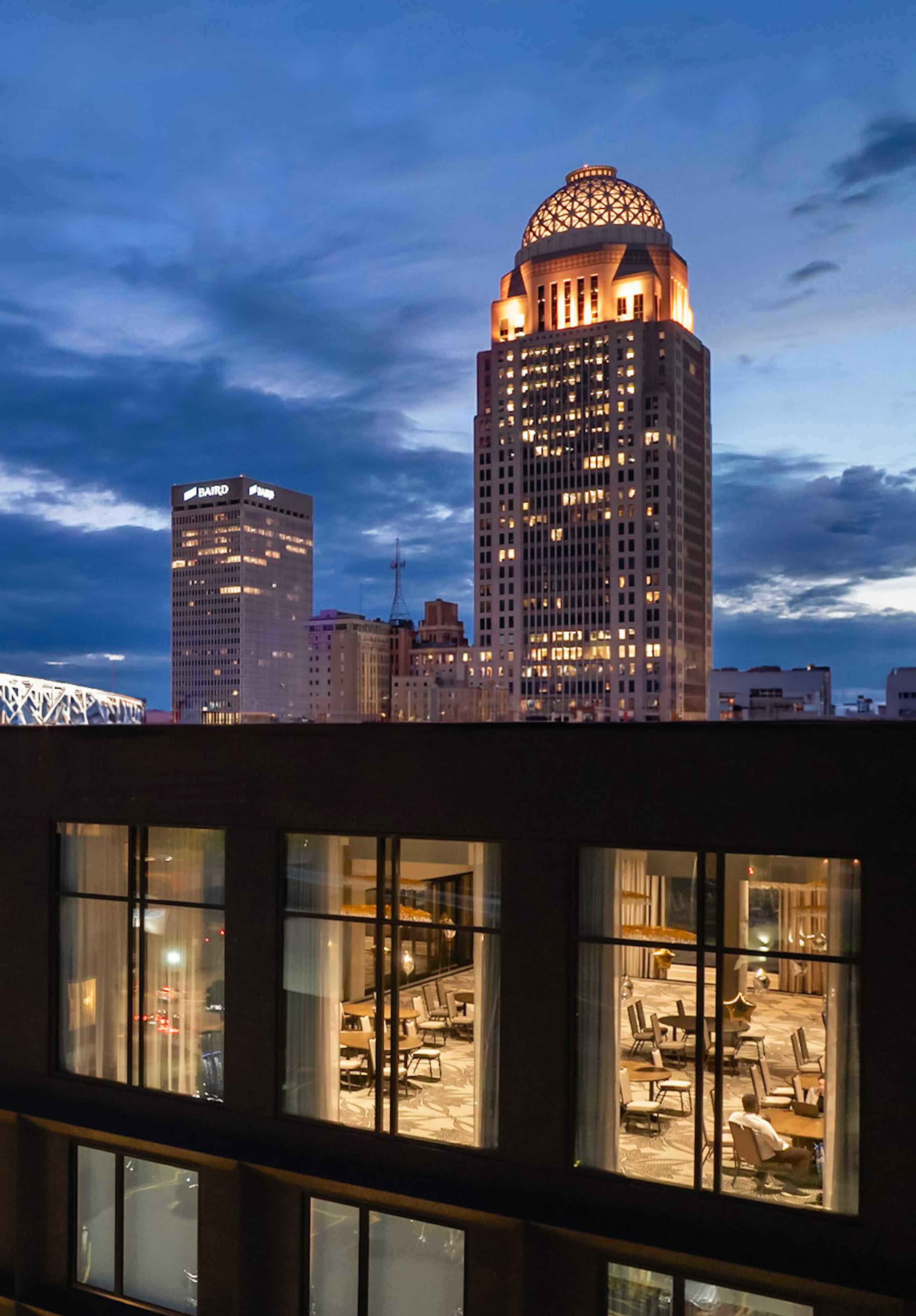A view of a city at night from a rooftop.
