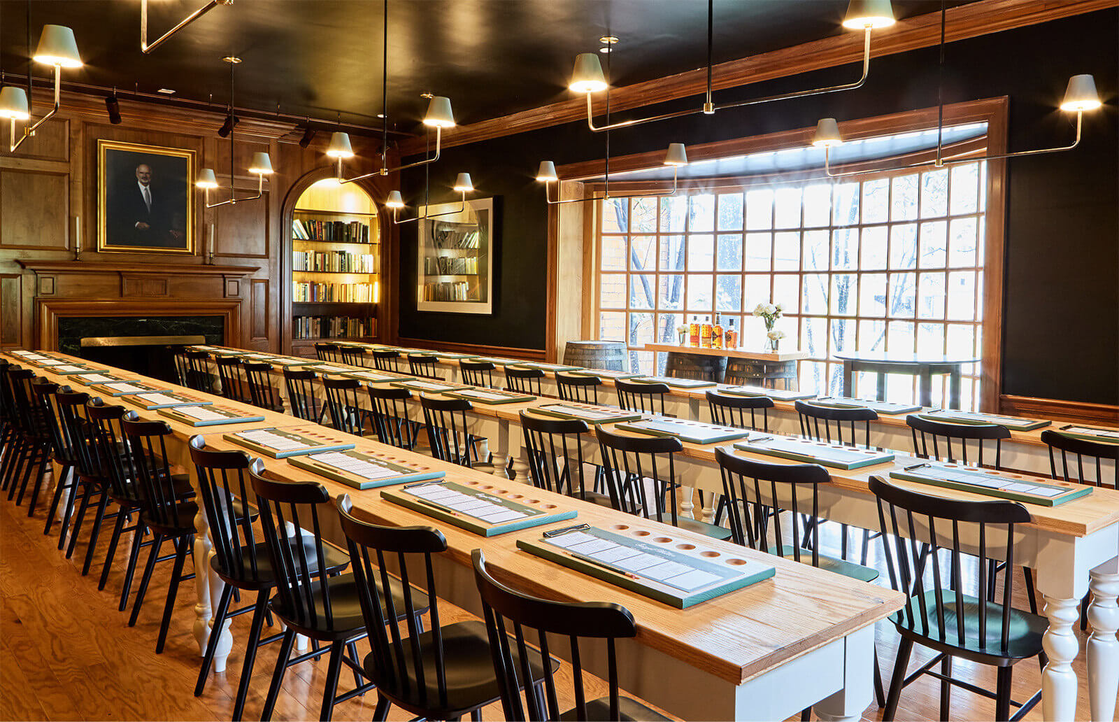 A long table with chairs and a menu on it.