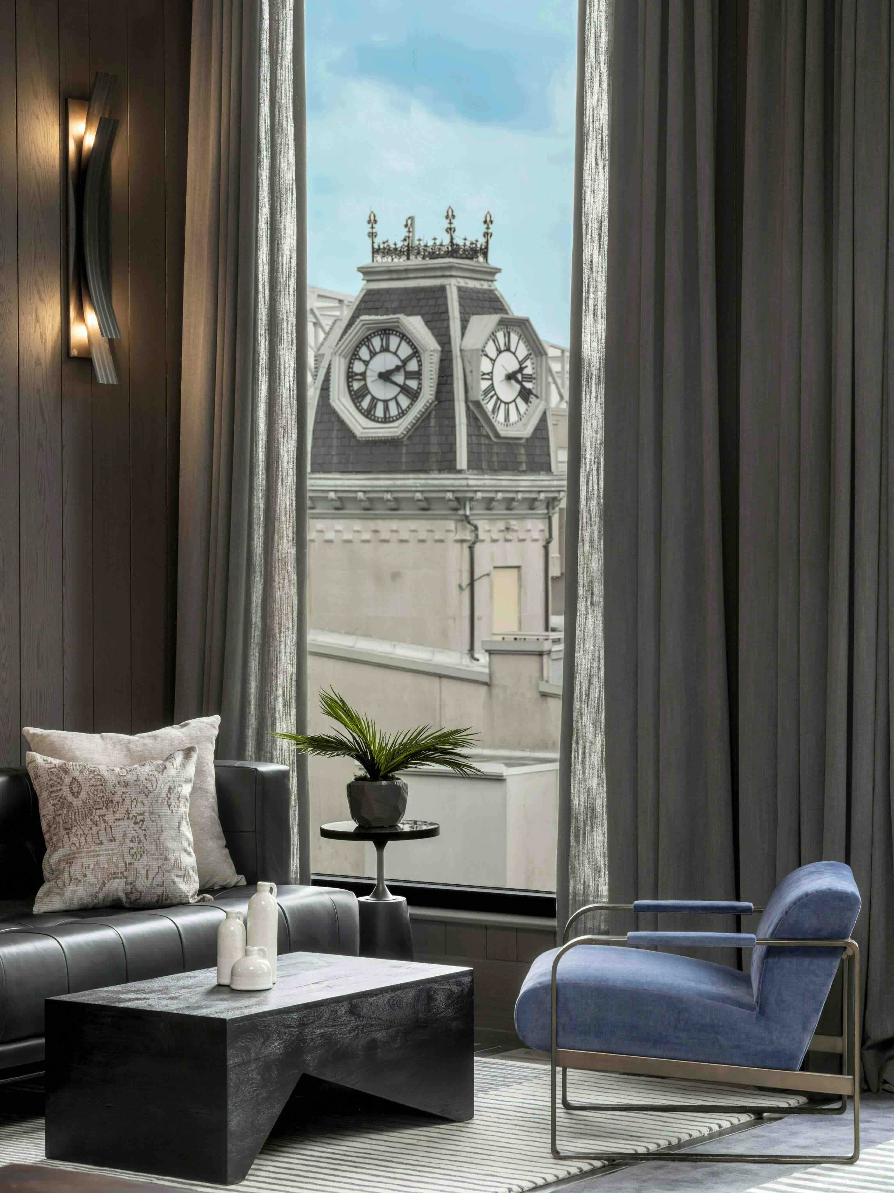 A living room filled with furniture and a large window.