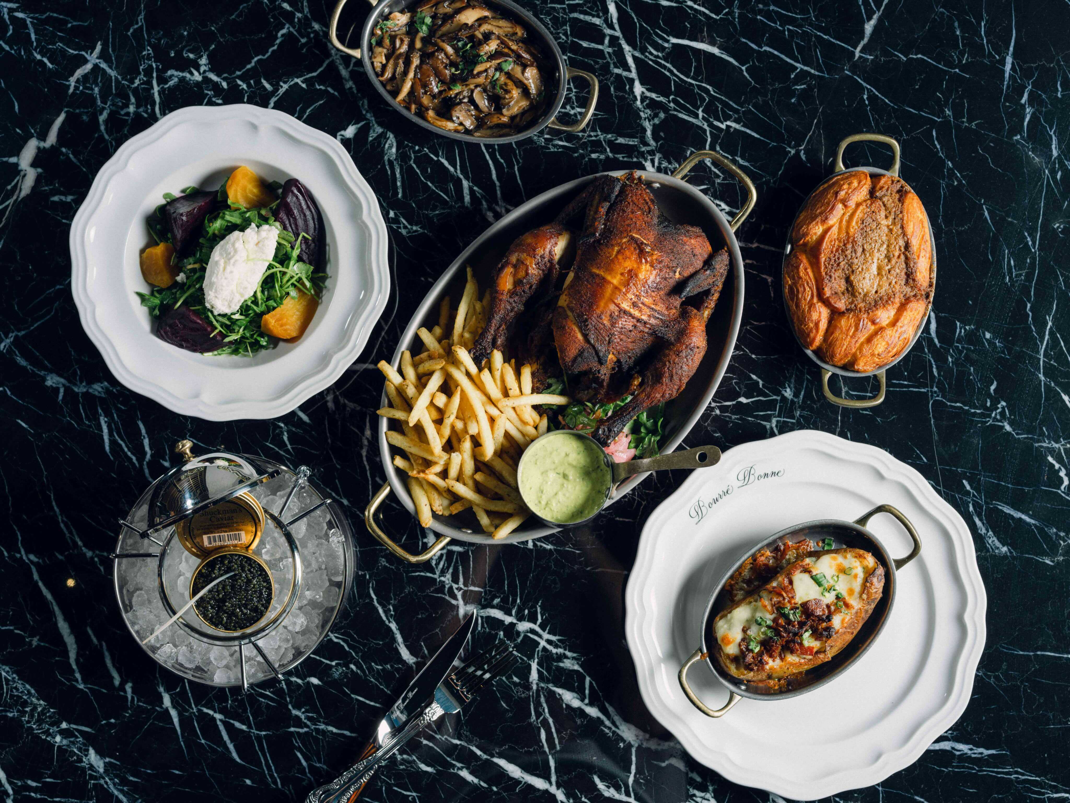 Couple Dining with Downtown Louisville Wedding Views at Hotel Bourré Bonne
