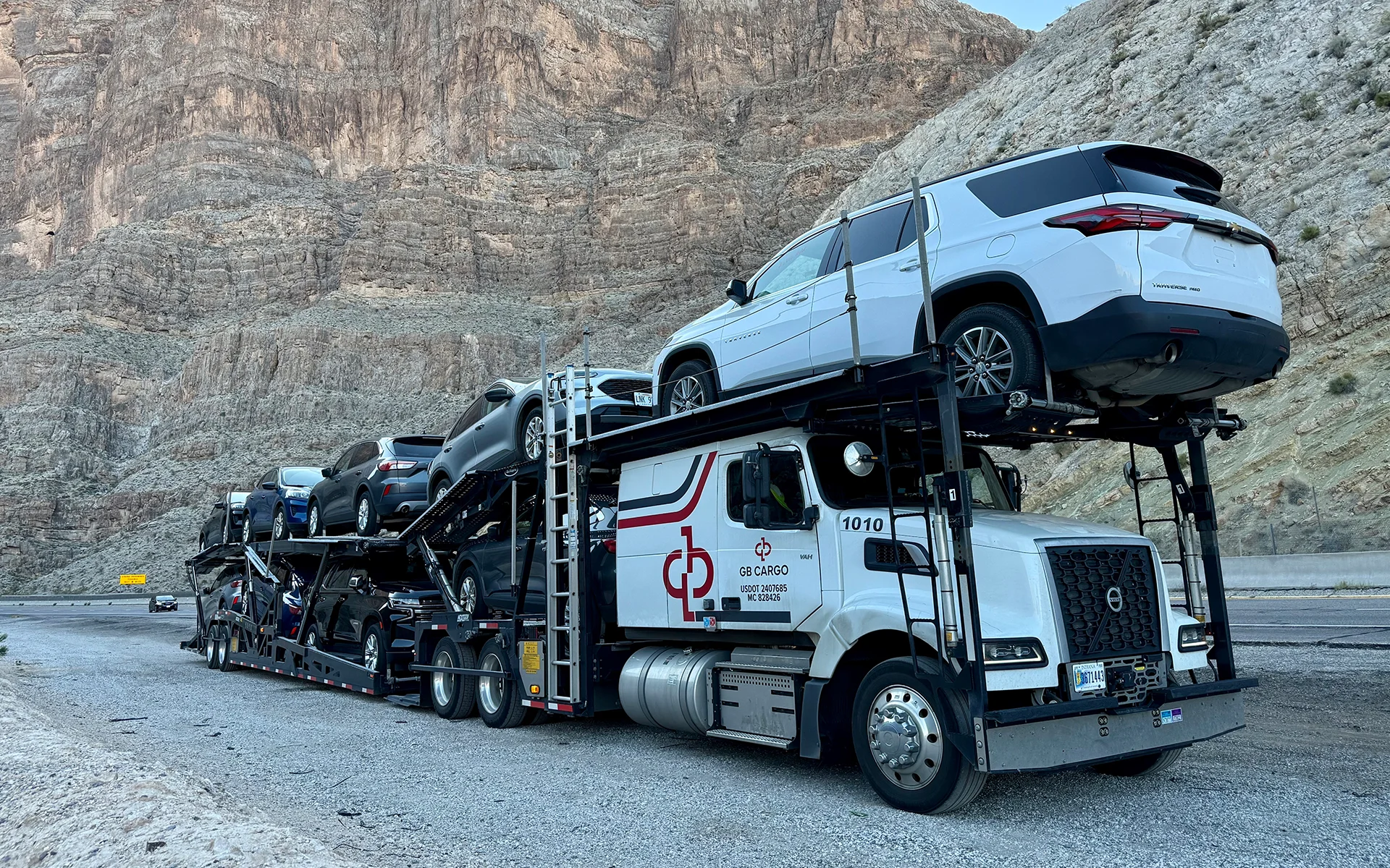 A GB Cargo's singer car hauling truck loaded with new cars from OEM.