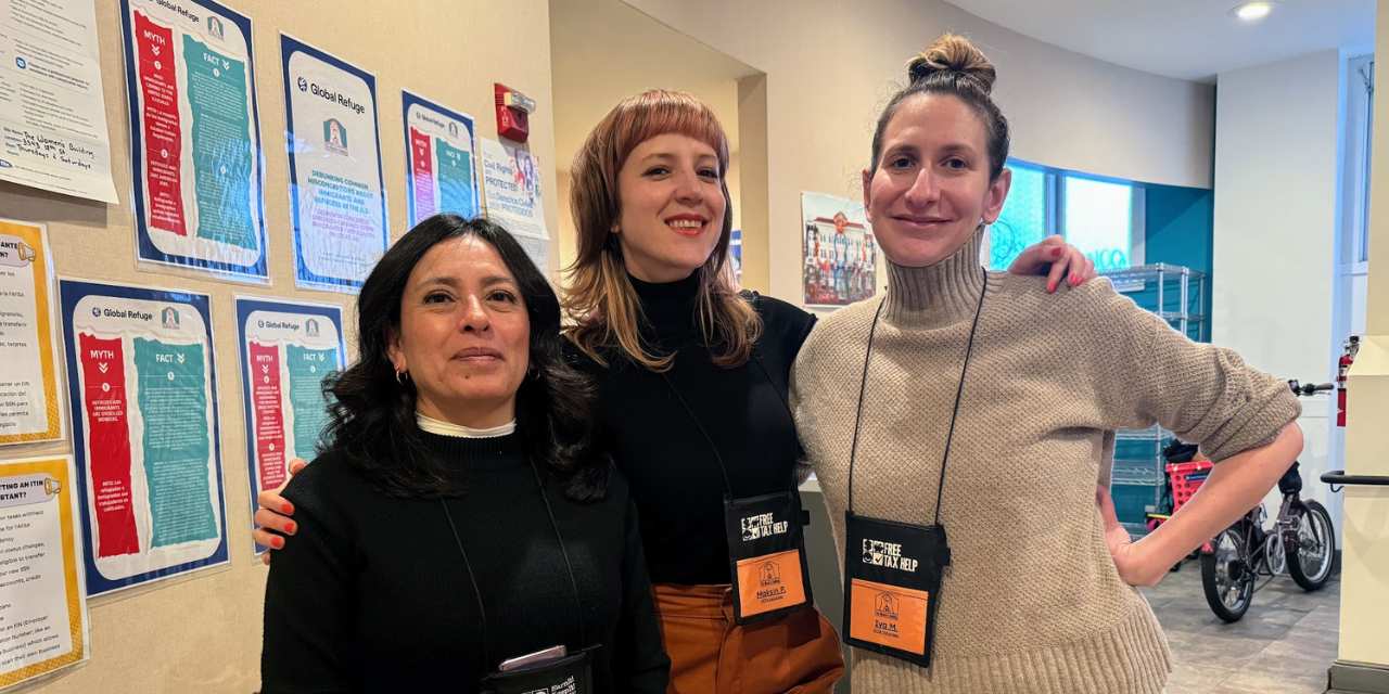 Maksin Puzar stands with fellow volunteers who support free tax preparation services and resource navigation for immigrant and working families.