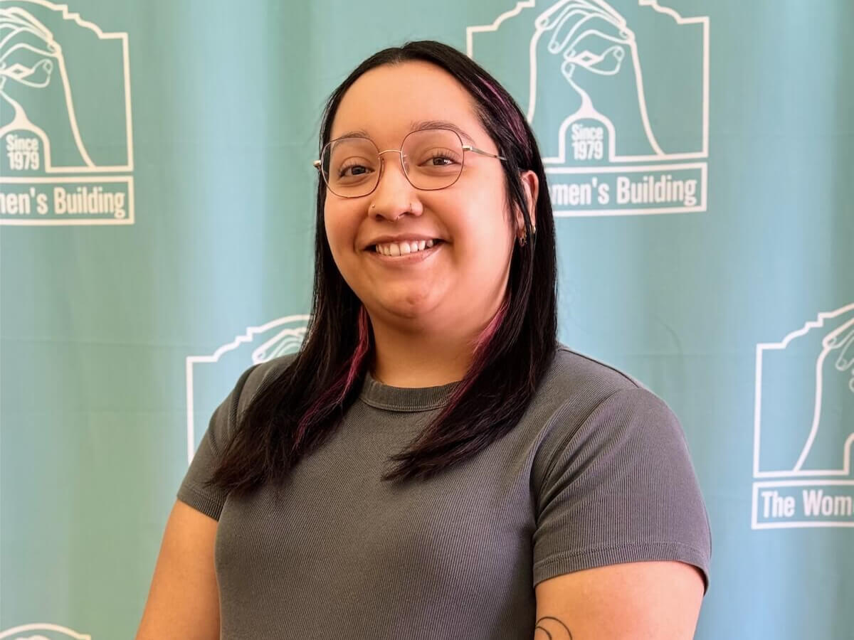 Jasmin Flores Portrait with The Women's Building backdrop.