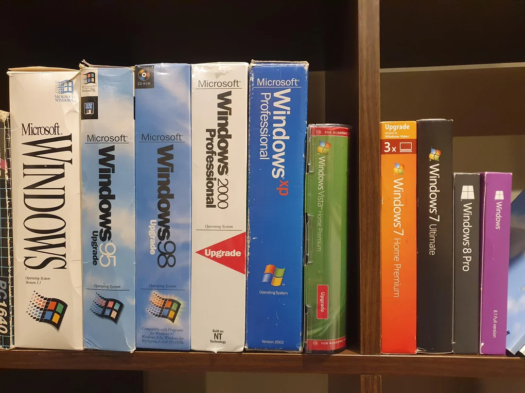 Microsoft Windows 95 boxes illustrating outdated ready-made software packages.