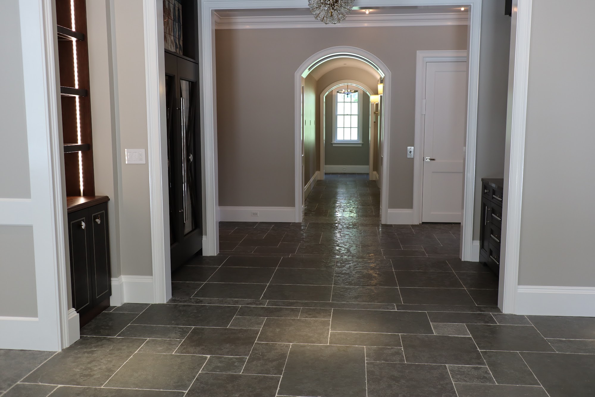 Volcanic stone floor installed over Ditra-Heat radiant system