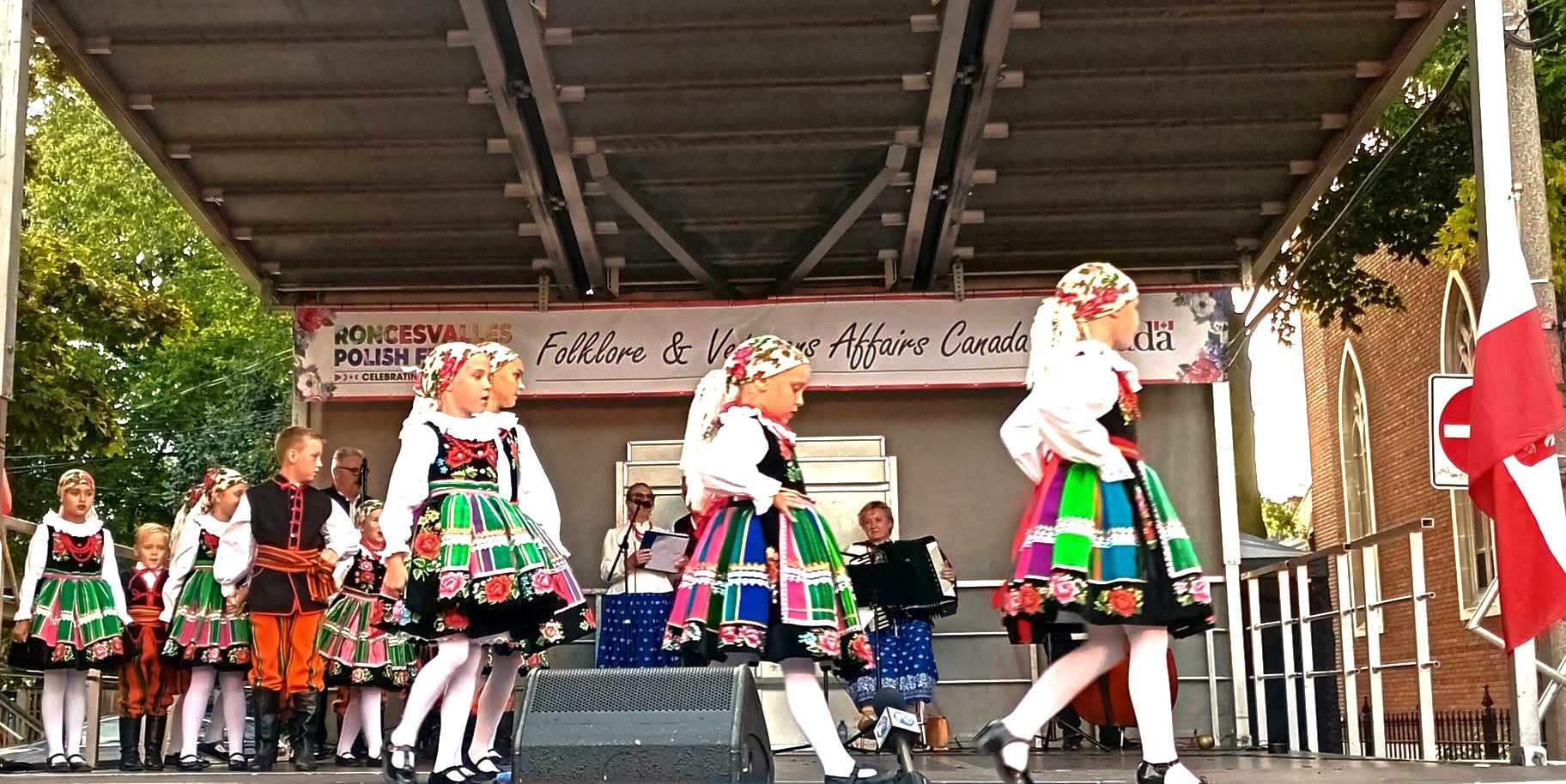 Polish folk dancers in traditional costume on stage