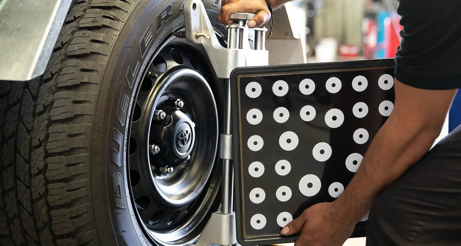 Laser wheel alignment head fitted to a wheel in the MASC workshop in Bassendean