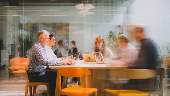 A group of people learning new skills online at the office