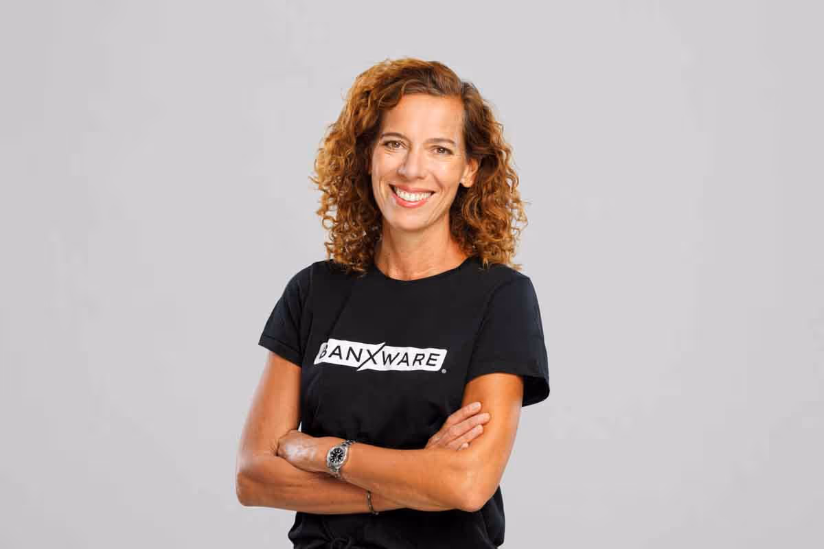 Banxware team member portrait Miriam, founder and co-CEO of Banxware, woman with dark curly hair smiling