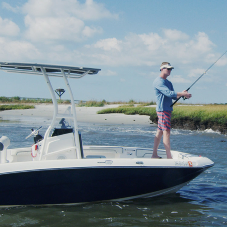 Angler casting from the bow of a Shark Bait private fishing charter boat on the back bays in Ocean City, NJ