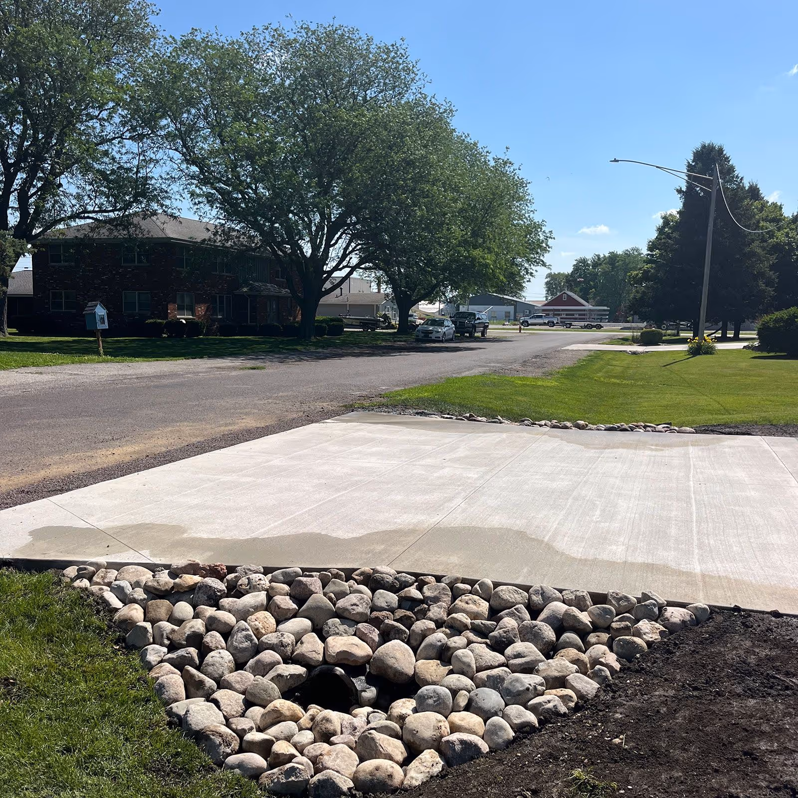 New concrete driveway poured by FB Outdoor Services – residential driveway contractors near me