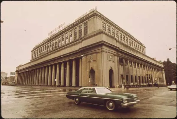 Retro picture of a car in front of a building