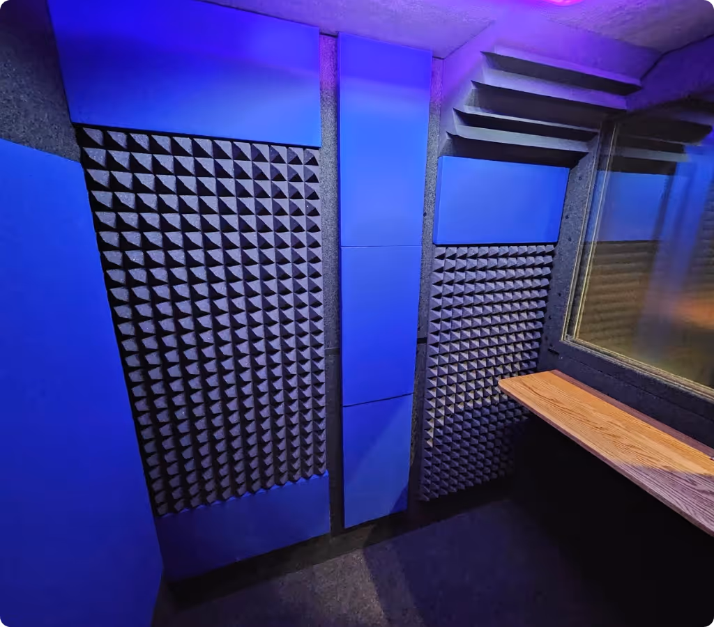 Interior of a WhisperRoom voice over booth showing acoustic foam and absorption panels for clean vocal recording.