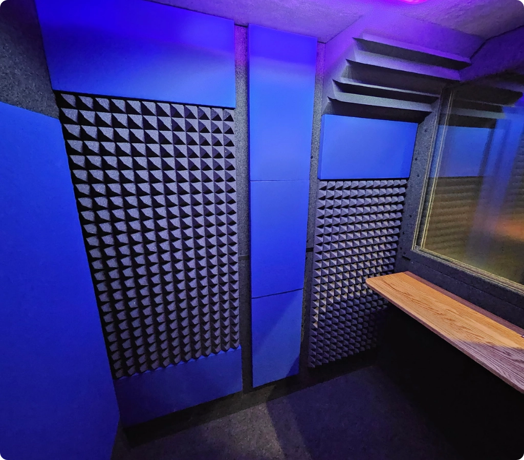 Interior of a WhisperRoom voice over booth showing acoustic foam and absorption panels for clean vocal recording.