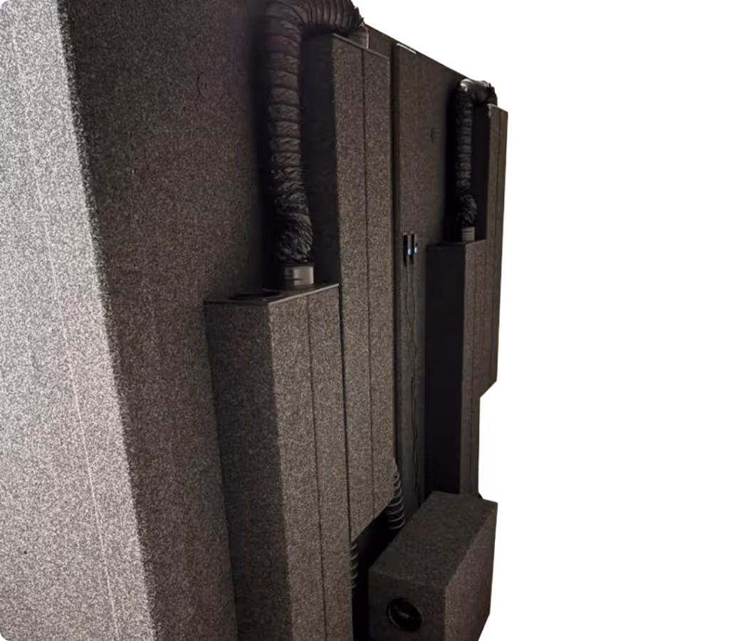 WhisperRoom ventilation system with VSS and EFS components on the exterior of a sound isolation booth for quiet airflow during recording.
