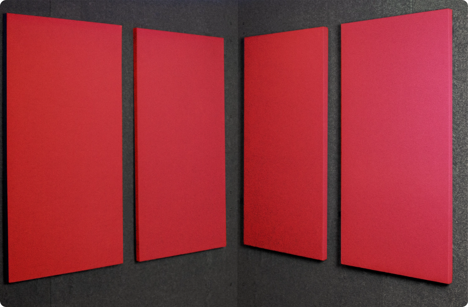 Geranium Audimute fabric acoustic panels installed inside a WhisperRoom sound booth, shown in a bold red finish