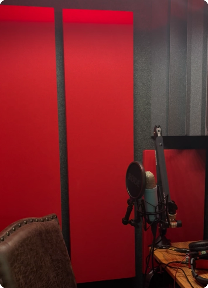 Voice over recording setup inside a WhisperRoom booth featuring Geranium Audimute fabric acoustic panels