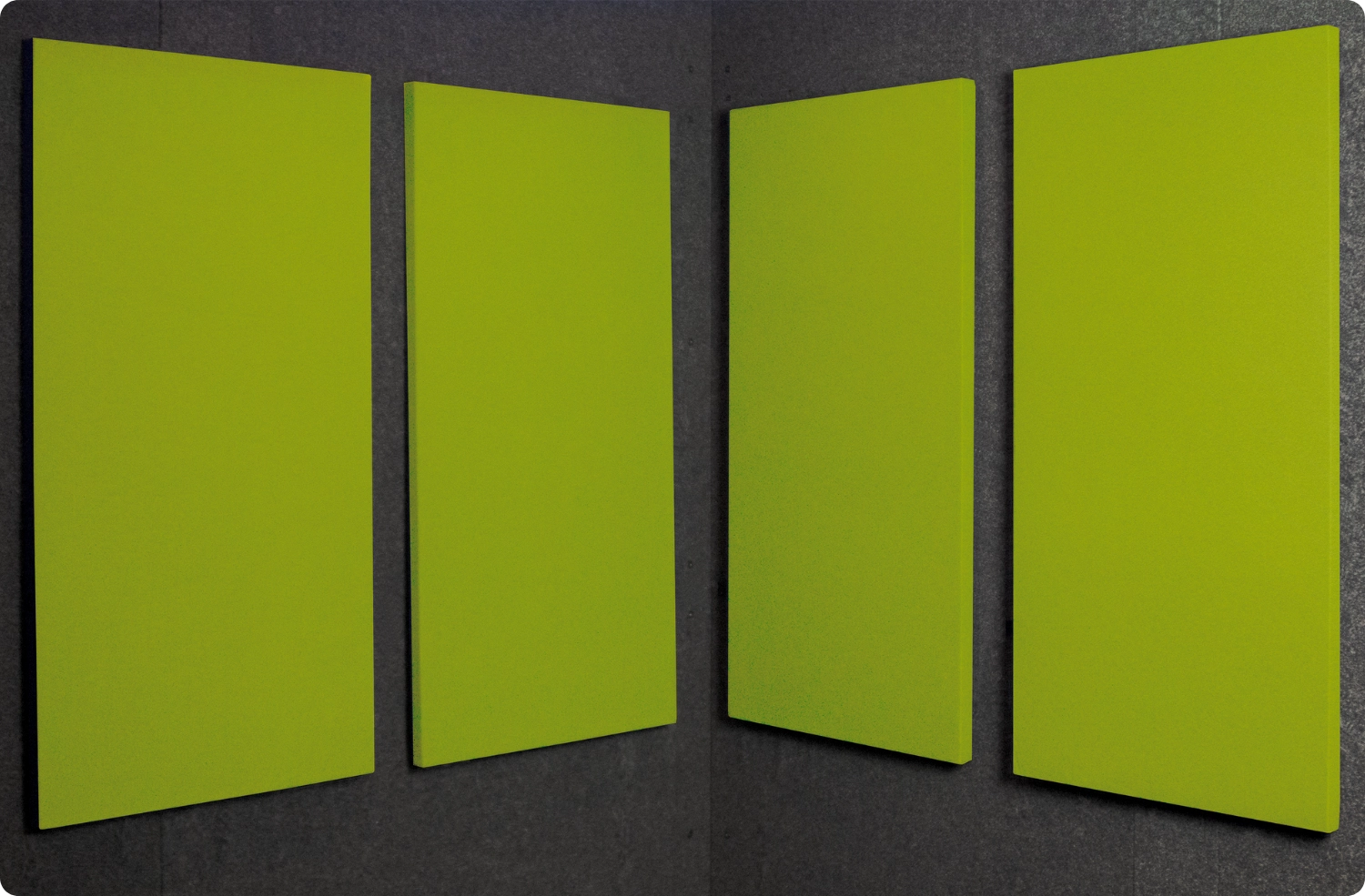 Green Apple Audimute fabric acoustic panels installed inside a WhisperRoom sound booth, shown in a bright green finish