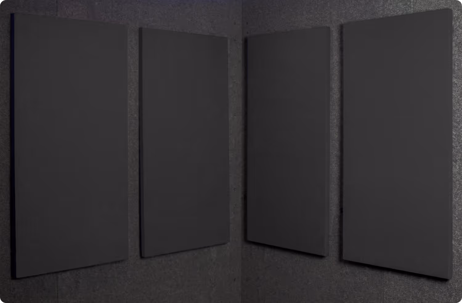 Graphite Audimute fabric acoustic panels installed inside a WhisperRoom sound booth, shown in a dark gray finish
