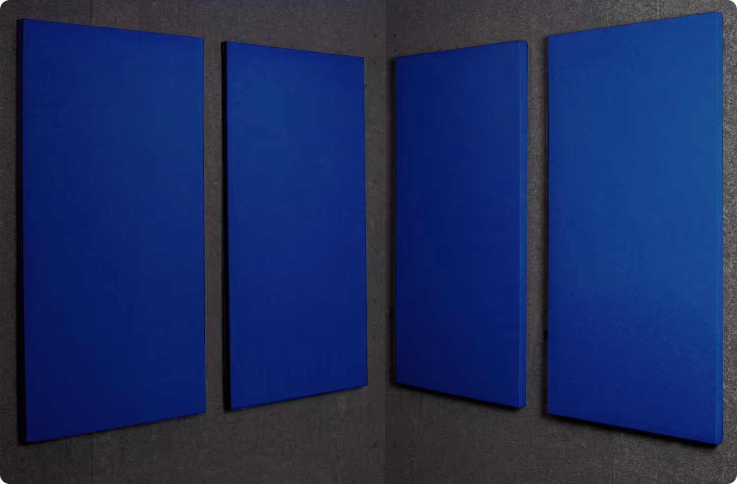 Lapis Audimute fabric acoustic panels installed inside a WhisperRoom sound booth, shown in a deep blue finish