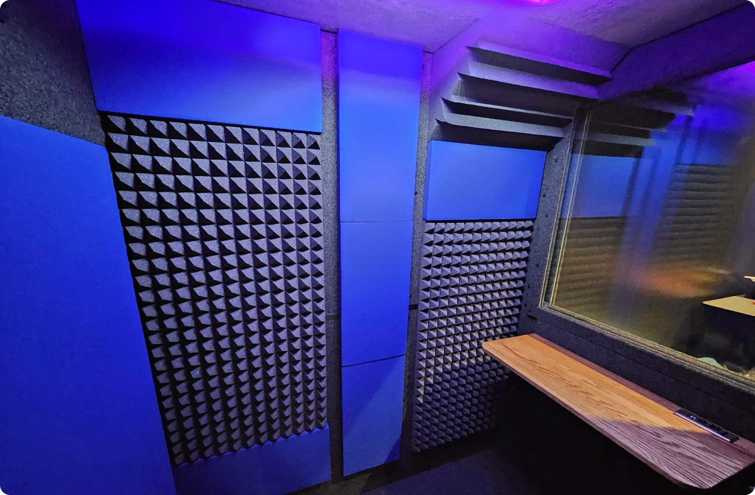 Voice over recording setup inside a WhisperRoom booth featuring Lapis Audimute fabric acoustic panels