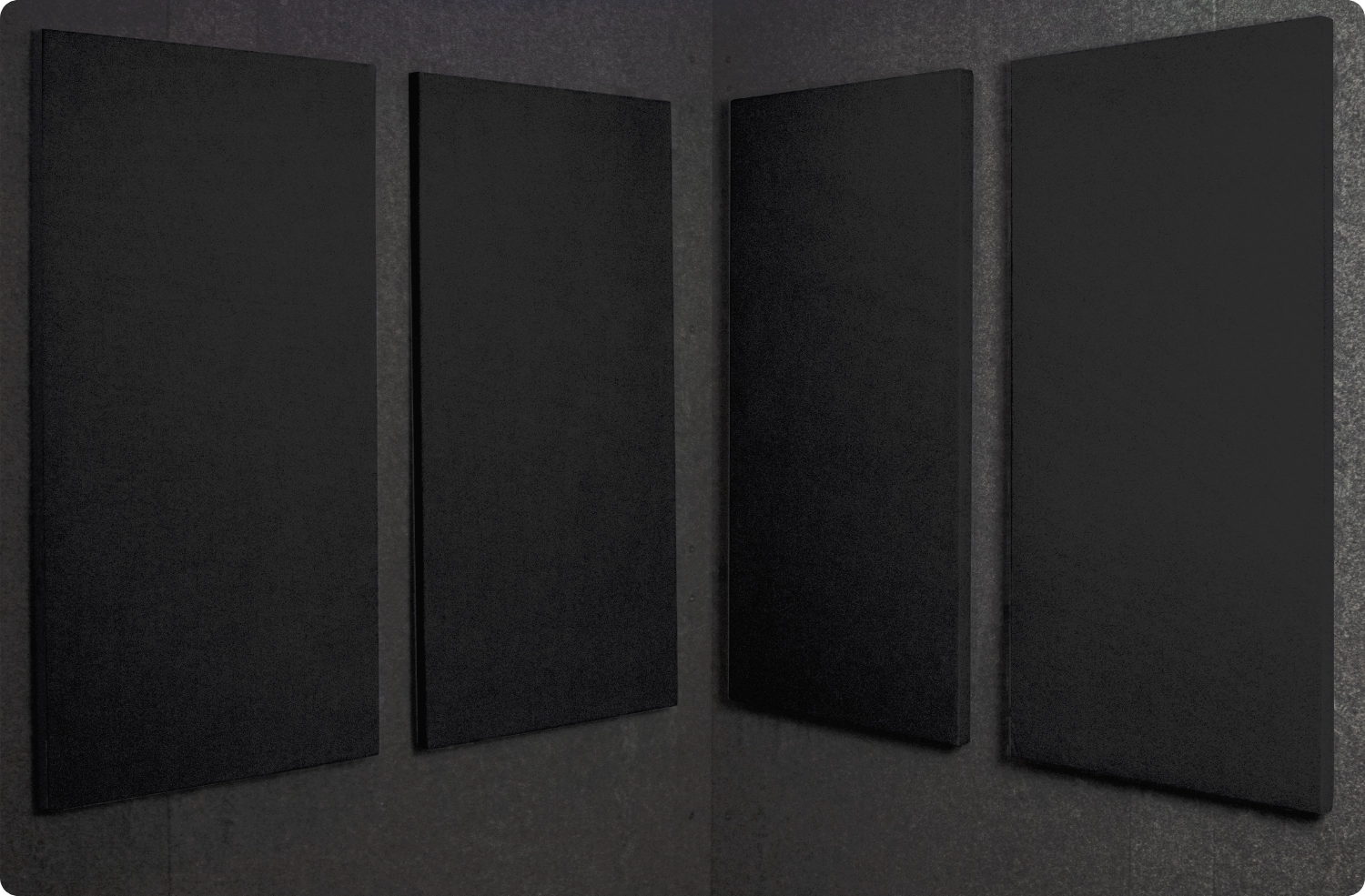 Onyx Audimute fabric acoustic panels installed inside a WhisperRoom sound booth, shown in a dark black finish