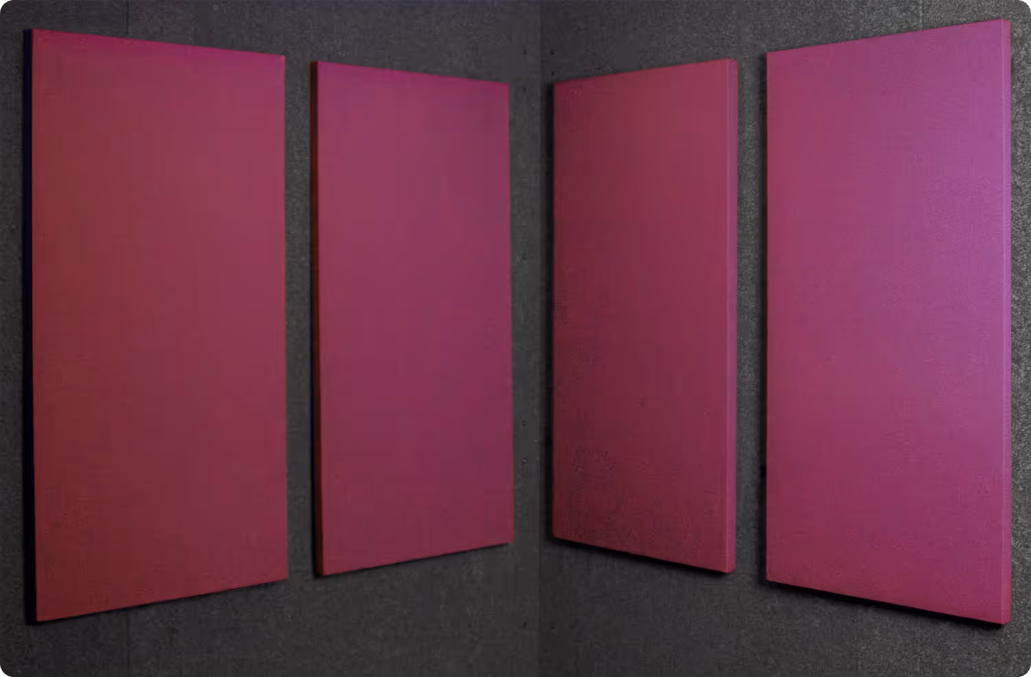 Orchid Audimute fabric acoustic panels installed inside a WhisperRoom sound booth, shown in a bold purple finish