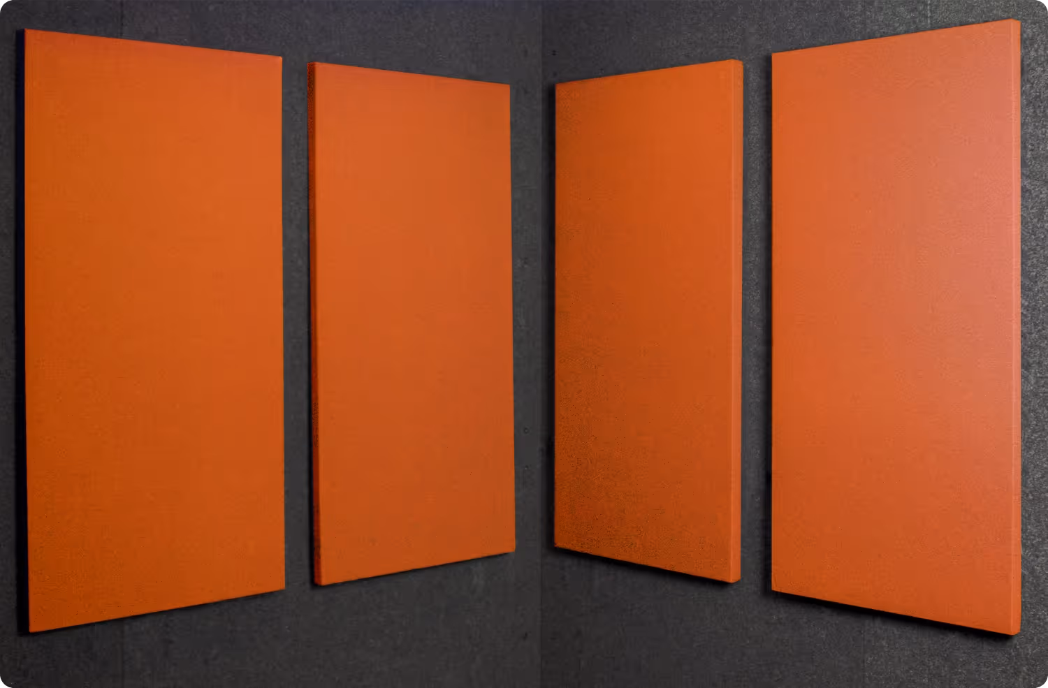 Pumpkin Audimute fabric acoustic panels installed inside a WhisperRoom sound booth, shown in a warm orange finish