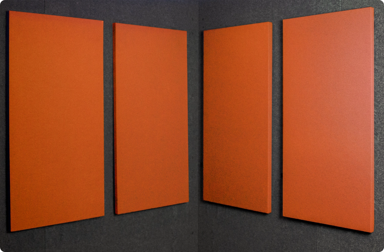 Pumpkin Audimute fabric acoustic panels installed inside a WhisperRoom sound booth, shown in a warm orange finish
