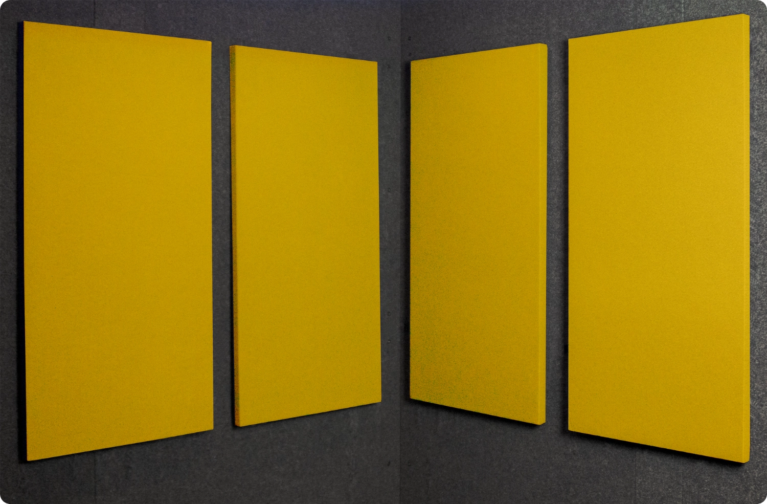 Lemon Audimute fabric acoustic panels installed inside a WhisperRoom sound booth, shown in a bright yellow finish