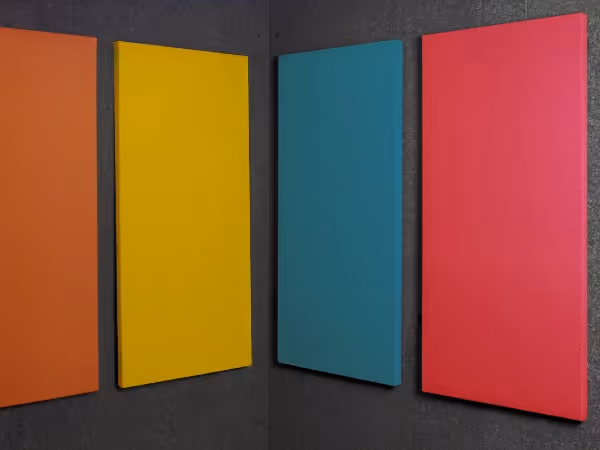 Audimute fabric acoustic panels installed inside a WhisperRoom sound booth, showing multiple color options side by side