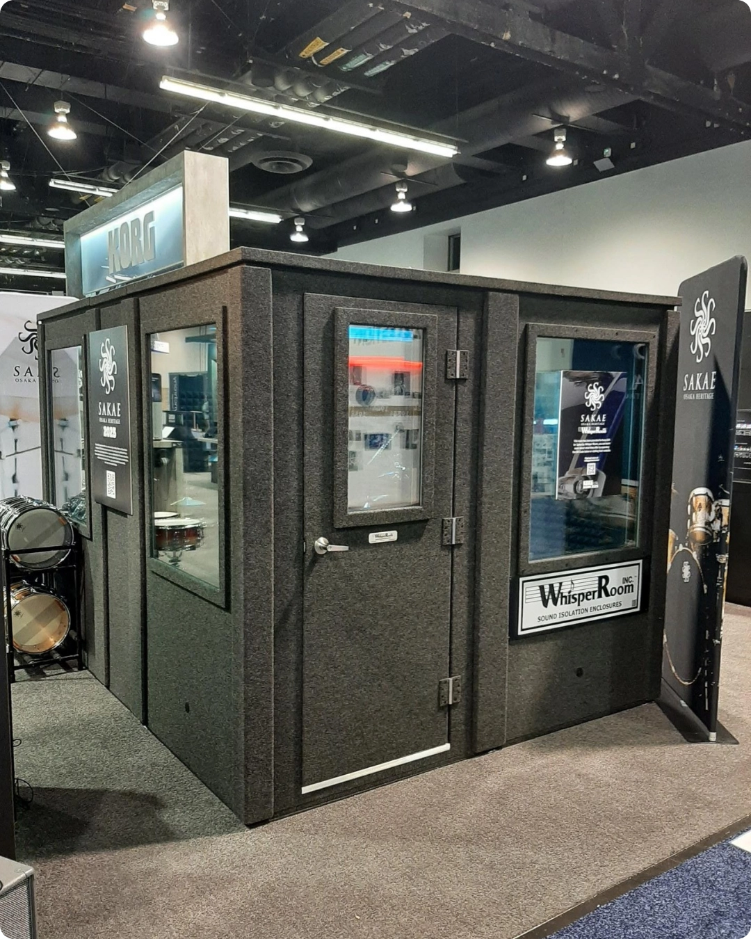 Korg trade show booth featuring a WhisperRoom sound isolation booth designed to create a calm, controlled brand environment
