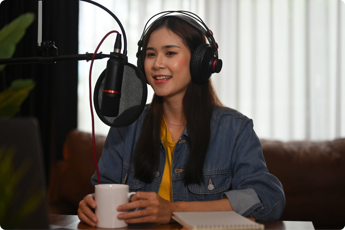 Content creator recording a podcast in a small home studio setup