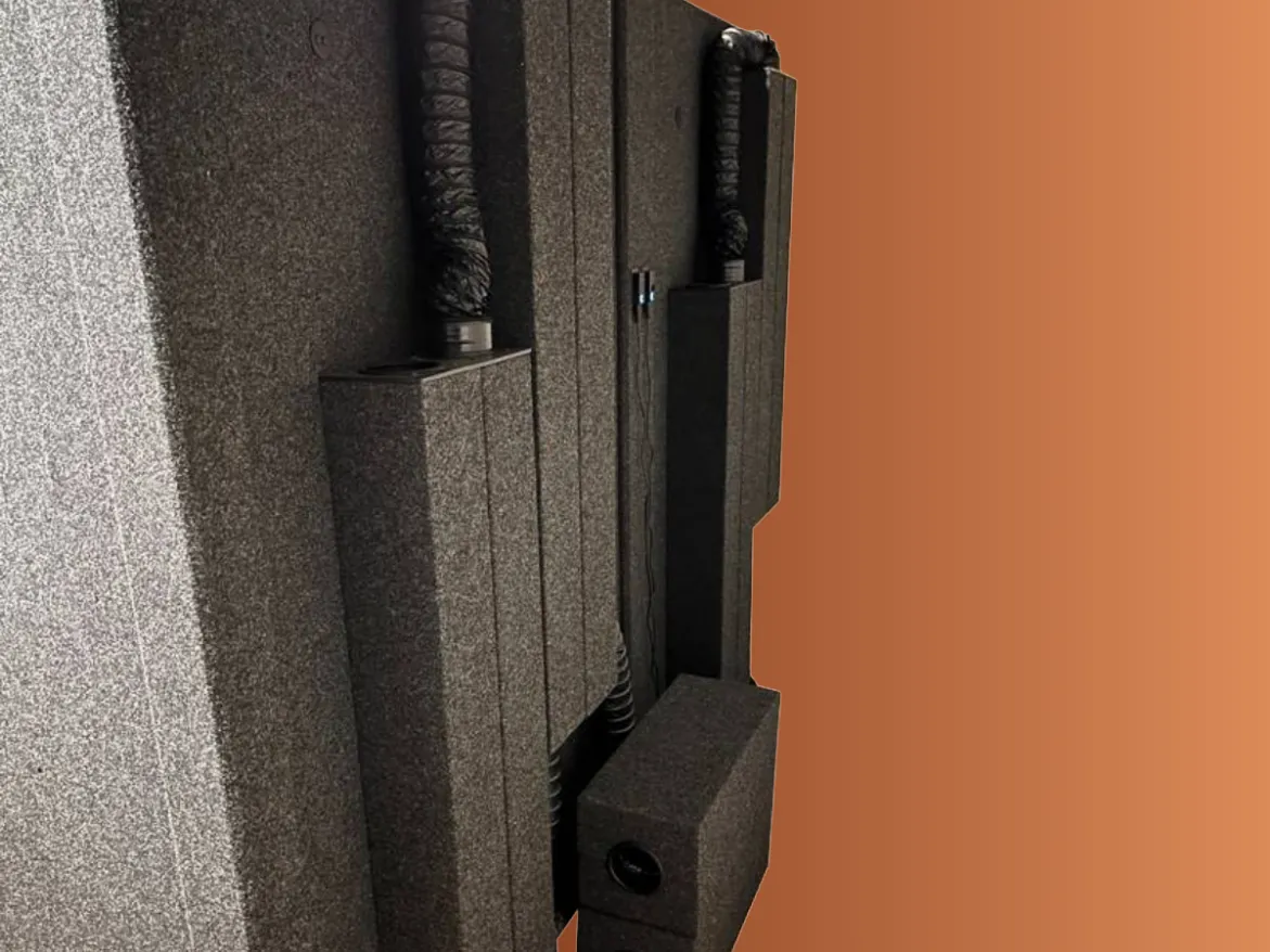 WhisperRoom sound-isolation booth with exterior ventilation ducts and acoustic ventilation boxes.