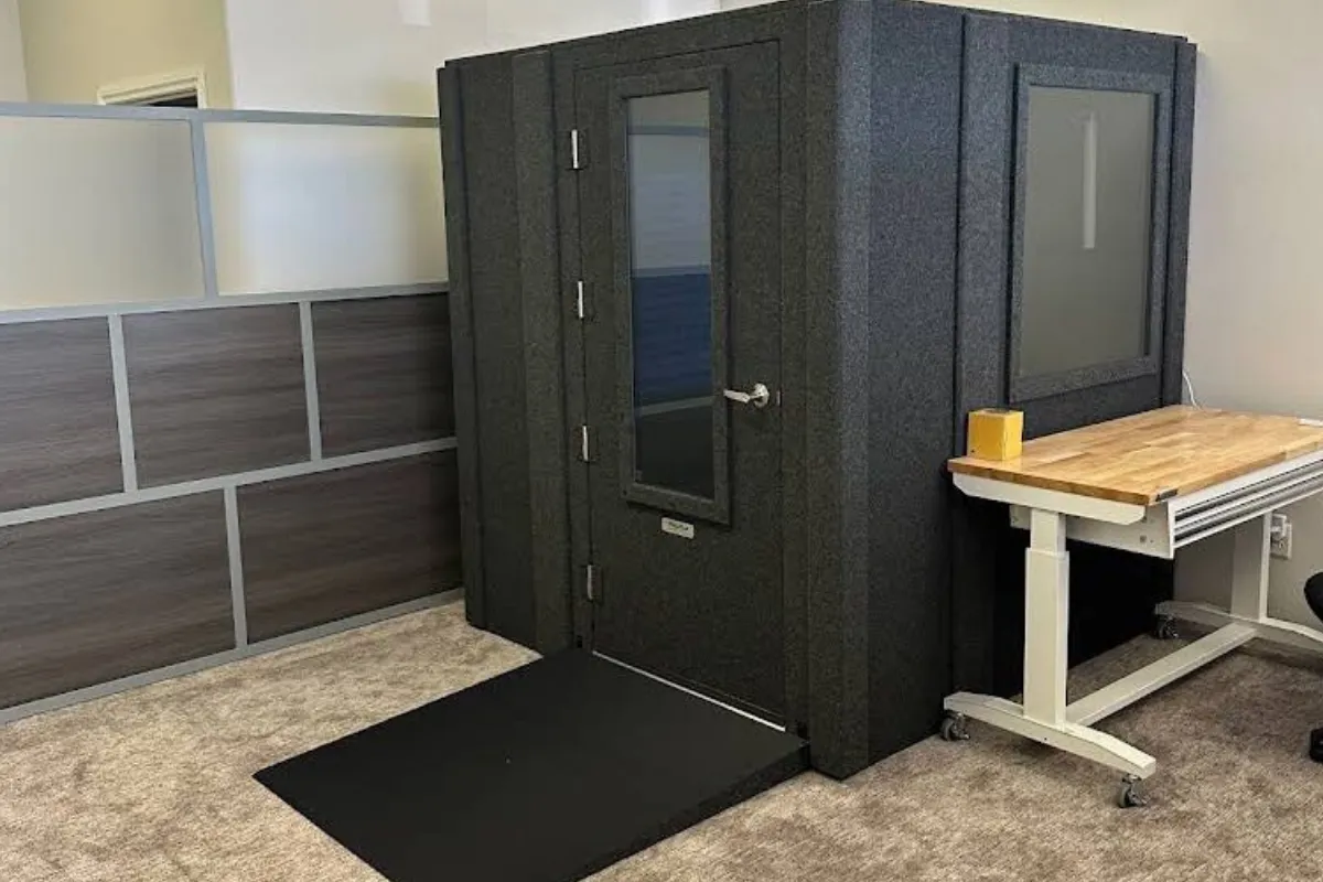 WhisperRoom audiometric booth with access ramp, wide door, and observation window installed at Precision Hearing.