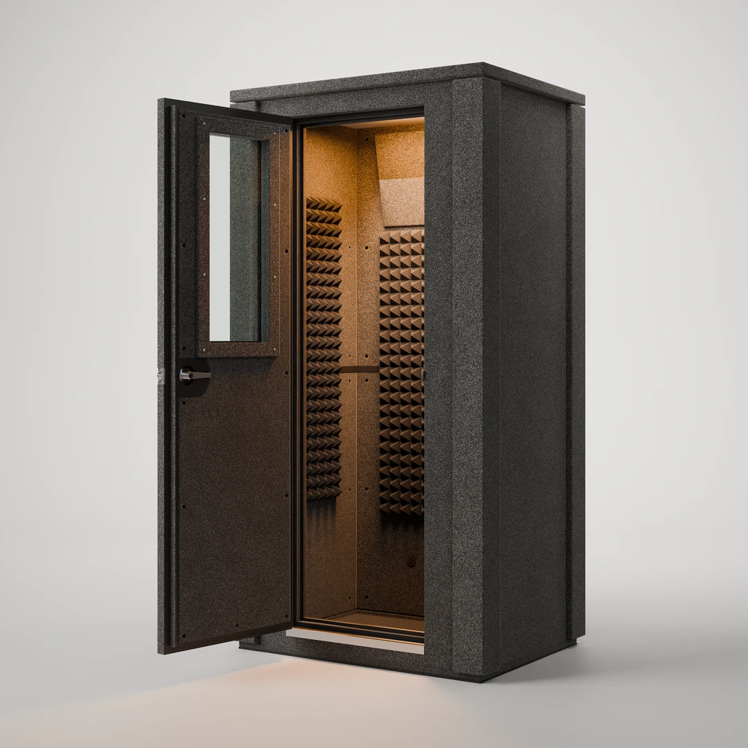 WhisperRoom MDL 4230 E double-wall isolation booth, open three-quarter view into the lit, foam-lined interior