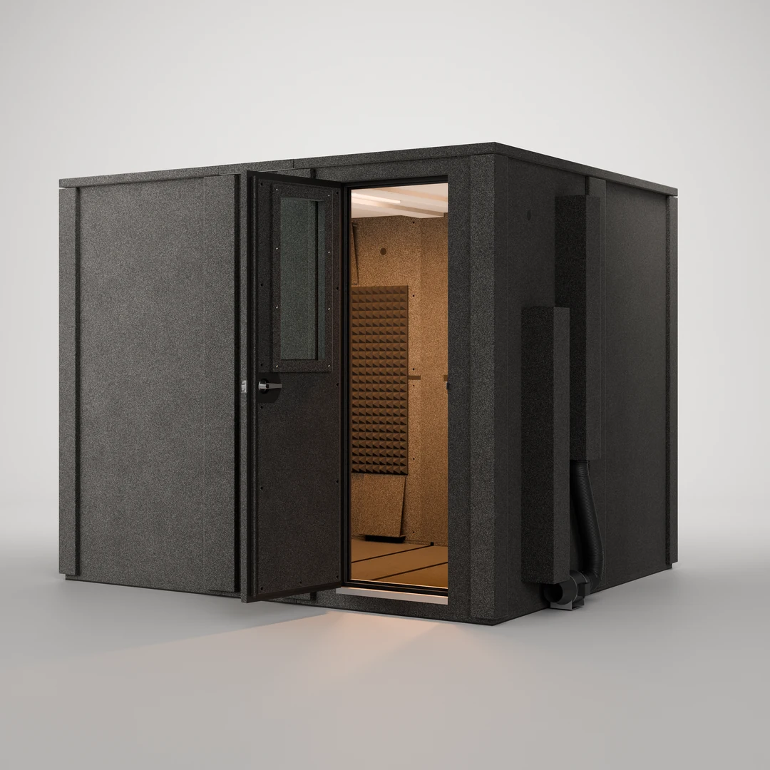 WhisperRoom MDL 84102 E 7' x 8.5' sound booth shown open, its interior lit and treated with Studiofoam panels