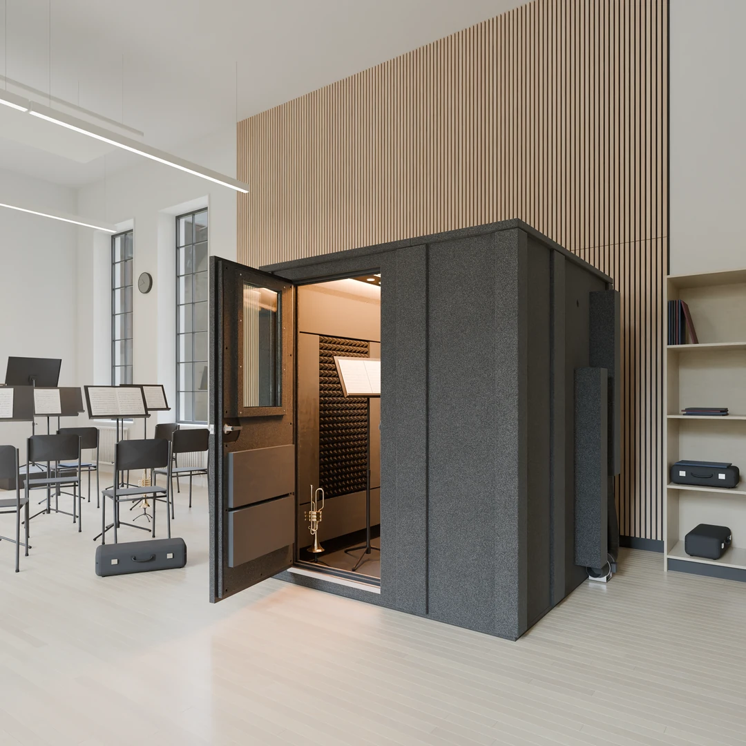 Practice Deluxe practice room in a school band room, door open on a trumpet stand and music stand beside black chairs