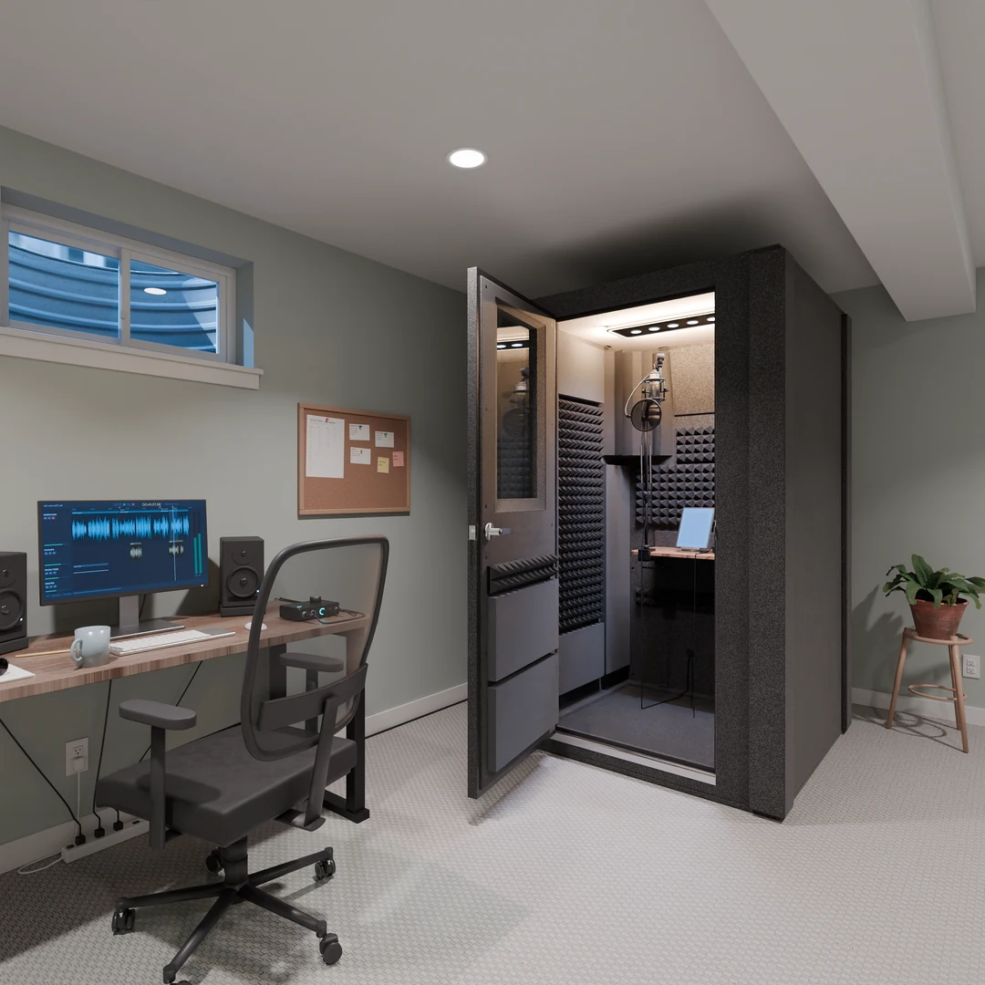 Voice Over Basic vocal booth open in a basement home office, a mic and laptop inside, desk and speakers beside it