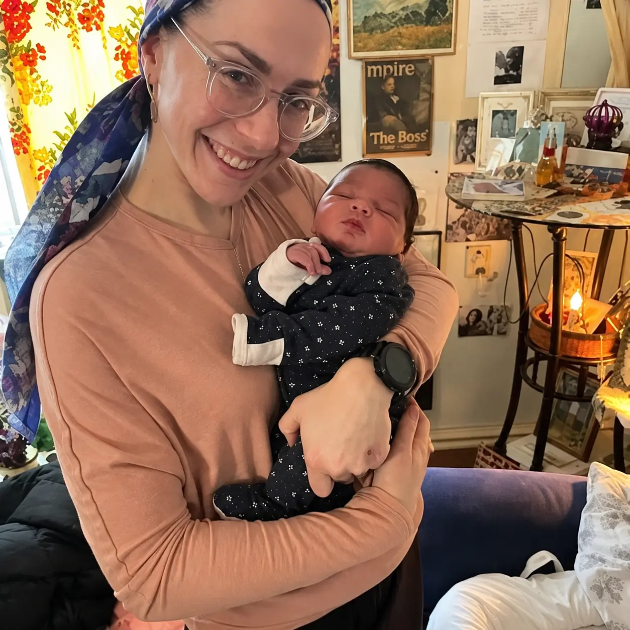 Midwife holding a baby at a birth center